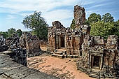 Angkor - Eastern Mebon - towered passageways leading to the first enclosure of the temple,  with stone lions guarding the entrance.